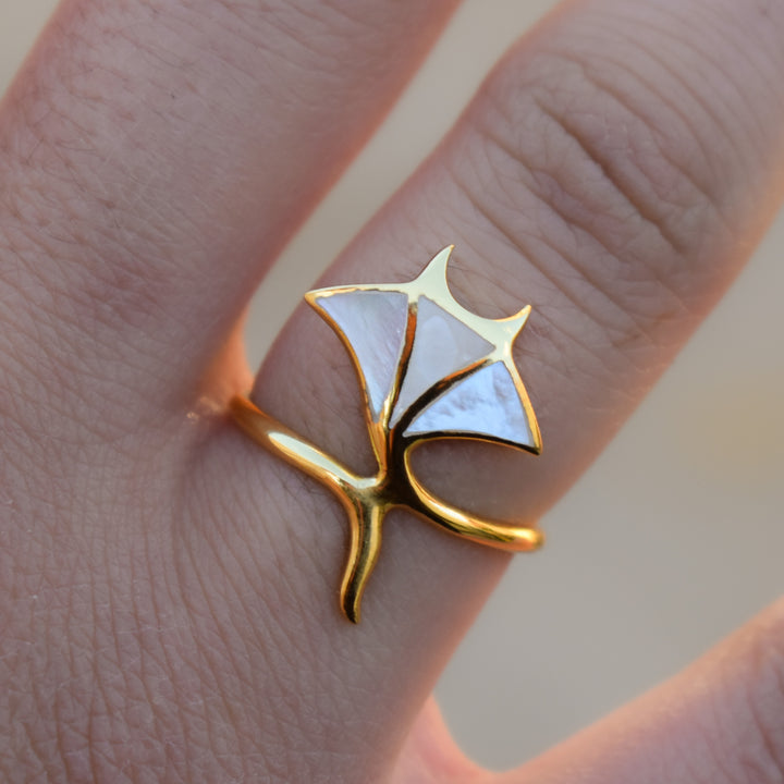 Gold manta ray ring with mother of pearl inlay, ocean-inspired waterproof jewellery design.