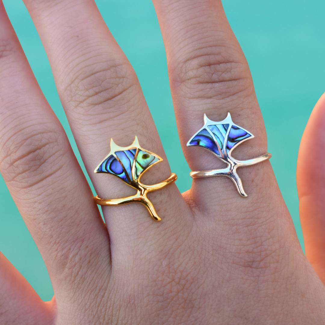 Gold and sterling silver manta ray rings with Paua shell inlay, ocean-inspired waterproof jewellery.