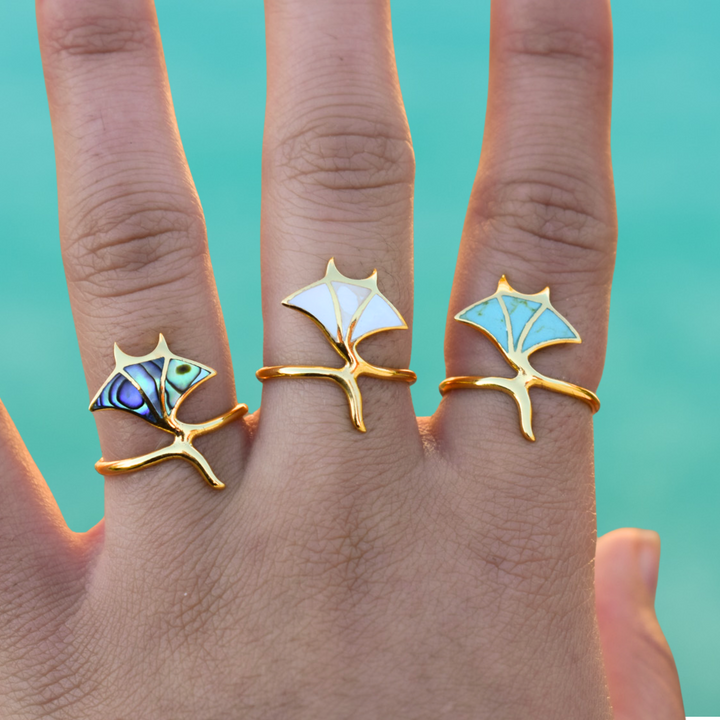 Gold manta ray rings with Paua shell, mother of pearl, and turquoise inlays, ocean-inspired stacking jewellery.