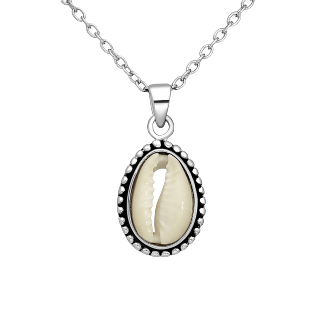 Sterling silver cowrie shell necklace on white background, ocean-inspired pendant