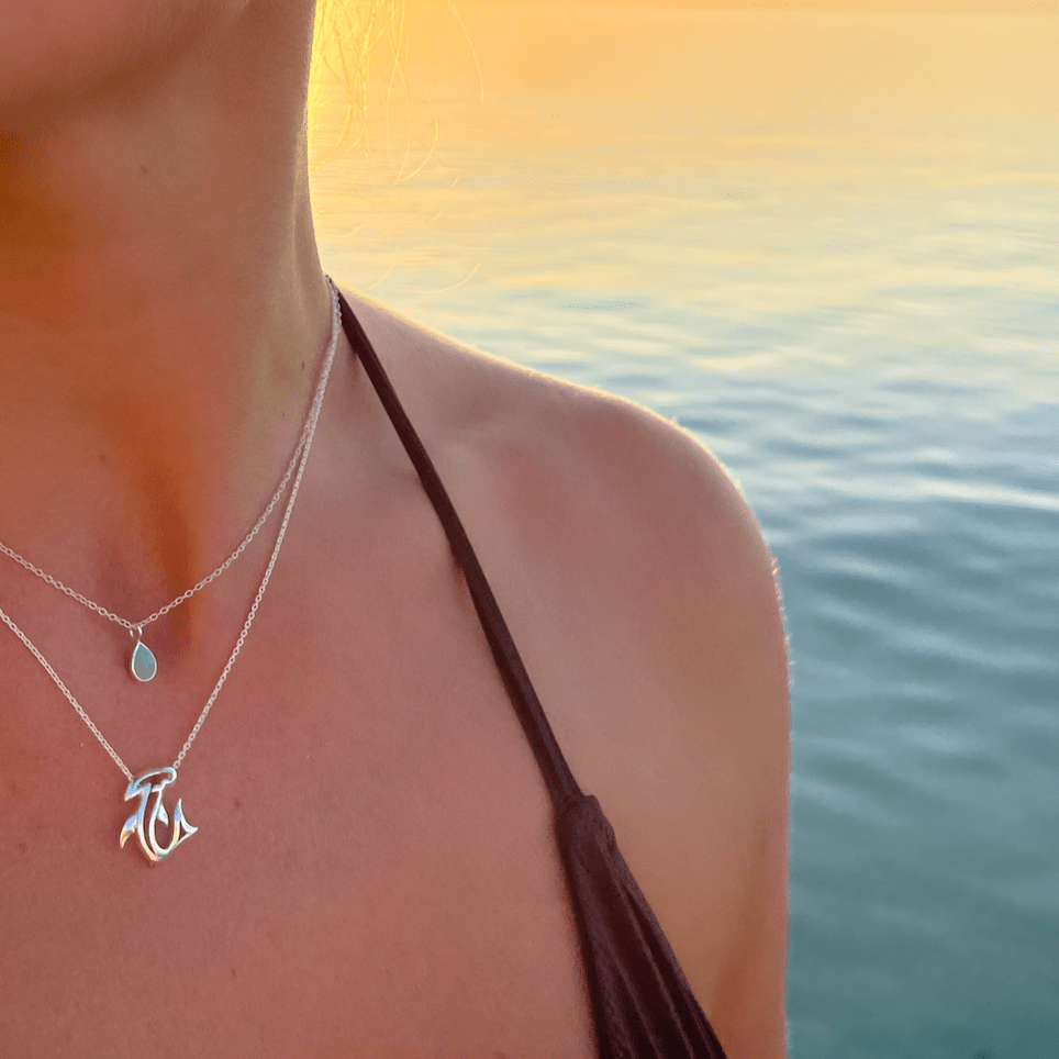 Hammerhead shark pendant necklace in sterling silver worn close to the neck