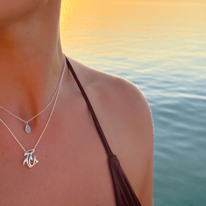 Hammerhead shark pendant necklace in sterling silver worn close to the neck