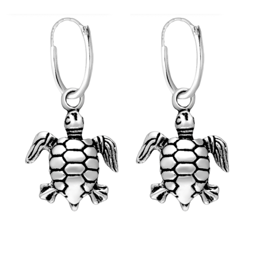 Sterling silver turtle hoop earrings on white background