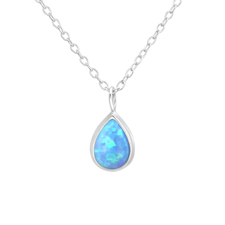 Sterling silver pear-shaped necklace with lab-grown blue opal on white background